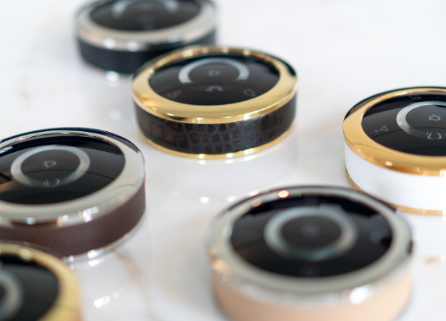 Gest buttons on table gold rings and leather